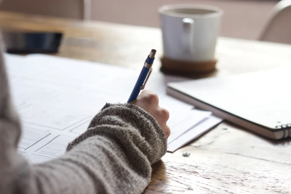 automate wordpress content creation workflow shown at a writing desk with laptop and coffee