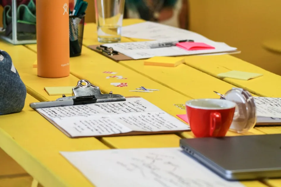 Content strategy for spiritual coaches: planning notes on a desk with coffee and pencil