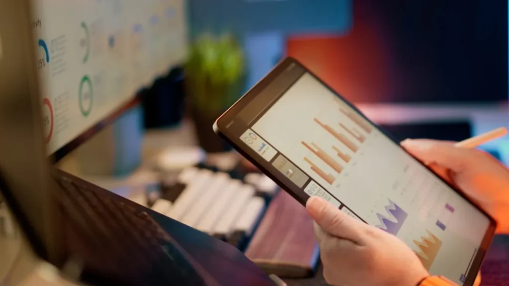 AI content creation for SEO illustrated through keyword research data analysis on a tablet screen.