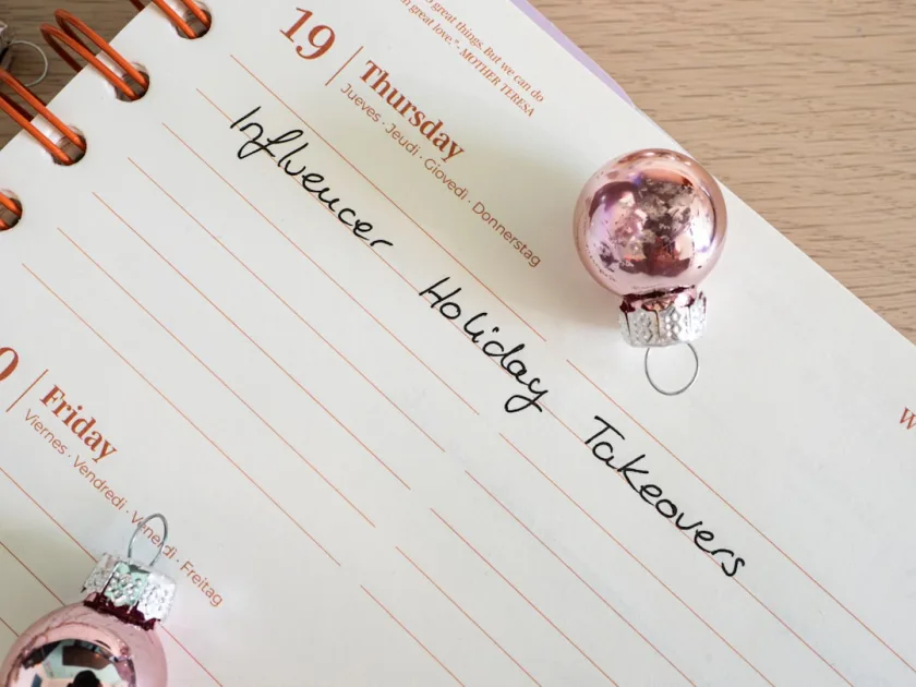 a notepad with a christmas ornament on it