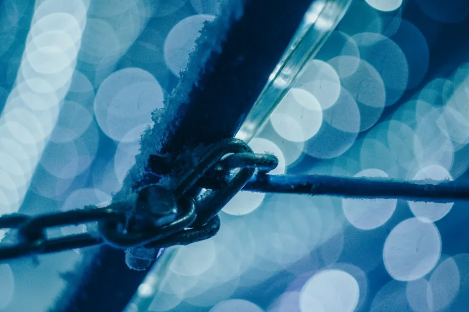 a close up of a chain on a fence