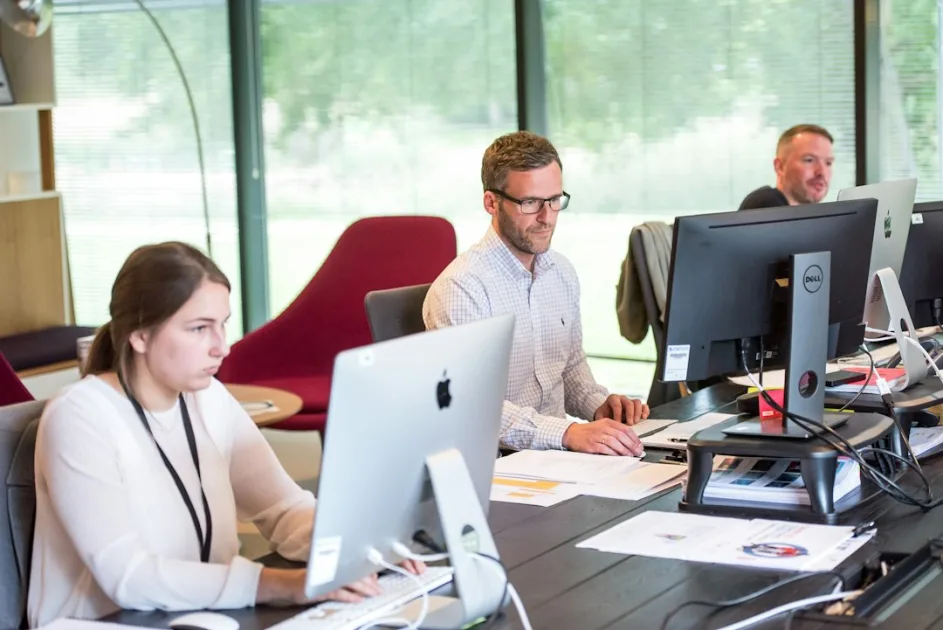scalable seo content editorial workflow team collaborating at a table