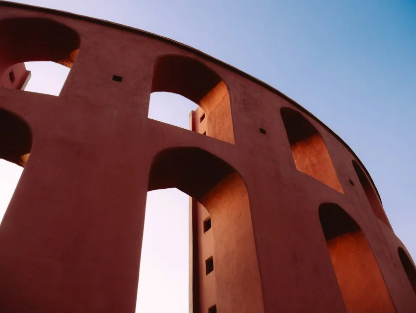 A tall red structure with a sky in the background